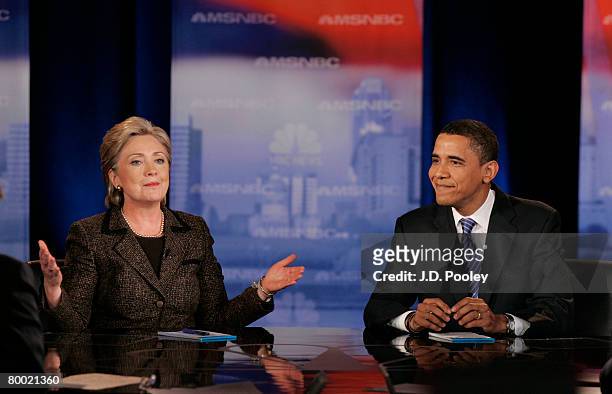 Democratic presidential hopeful Sen. Hillary Clinton speaks as Sen. Barack Obama smiles during a debate at Cleveland State University's Wolstein...