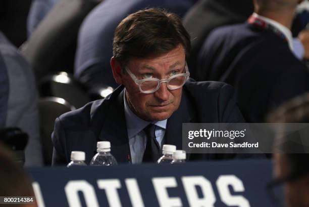 Wayne Gretzky of the Edmonton Oilers looks on from the draft table during Round One of the 2017 NHL Draft at United Center on June 23, 2017 in...