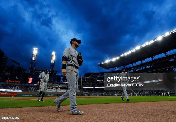 Nick Franklin of the Milwaukee Brewers walks off the field after the second inning against the Atlanta Braves at SunTrust Park on June 23, 2017 in...
