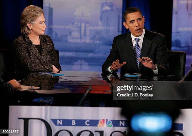 Democratic presidential hopeful Sen. Hillary Clinton looks on as Sen. Barack Obama speaks during a debate at Cleveland State University's Wolstein...