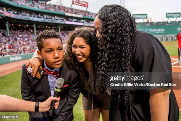Angelo, Alex, and Jessica Ortiz, children of former Boston Red Sox designated hitter David Ortiz of the Boston Red Sox announce 'Play Ball' during a...