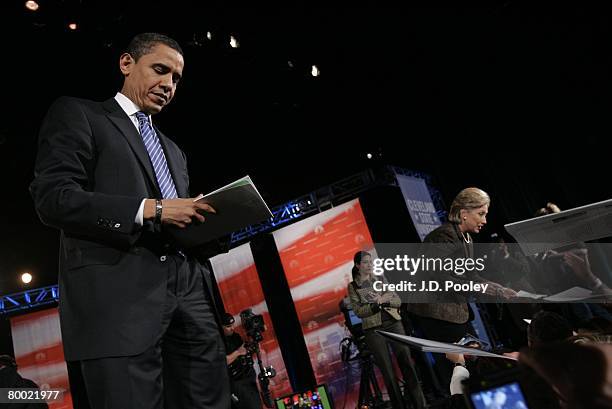 Democratic presidential hopeful Sen. Barack Obama and Sen. Hillary Clinton sign autographs after their debate at Cleveland State University's...