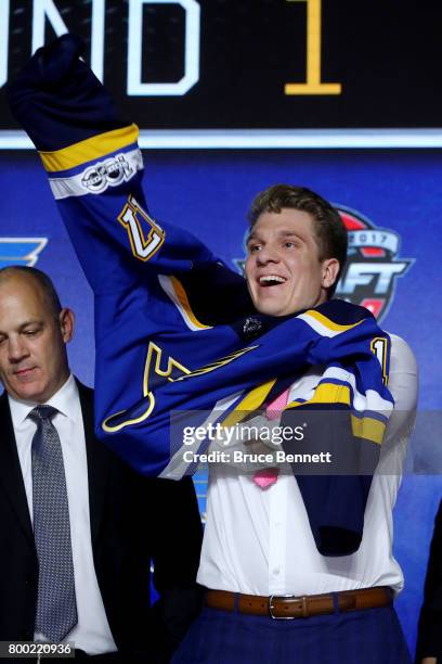 Robert Thomas puts on the St. Louis Blues jersey after being selected 20th overall during the 2017 NHL Draft at the United Center on June 23, 2017 in...