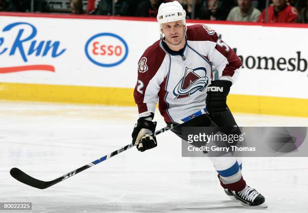 Adam Foote of the Colorado Avalanche skates against the Calgary Flames in his first game with the team after being acquired at the trade deadline...