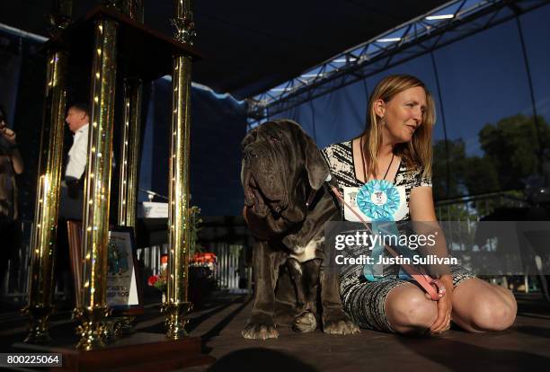 Shirley Zindler of Sebastopol, California sits with her Neapolitan Mastiff named Martha after after winning the 2017 World's Ugliest Dog contest at...