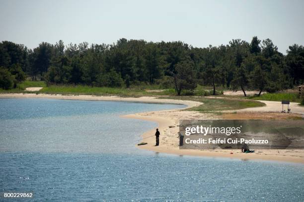 three fishermen at keramoti, kavala regional unit, east macedonia and thrace, northern greece - kavalla stock-fotos und bilder