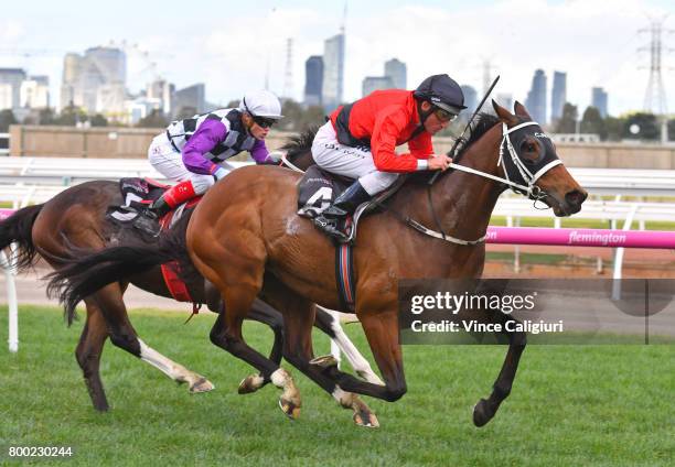 Damien Oliver riding Encosta Line wins Race 4 during Melbourne Racing at Flemington Racecourse on June 24, 2017 in Melbourne, Australia.