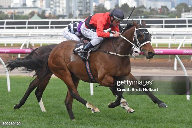 Encosta Line ridden by Damien Oliver wins the Grampians Region Handicap at Flemington Racecourse on June 24, 2017 in Flemington, Australia.