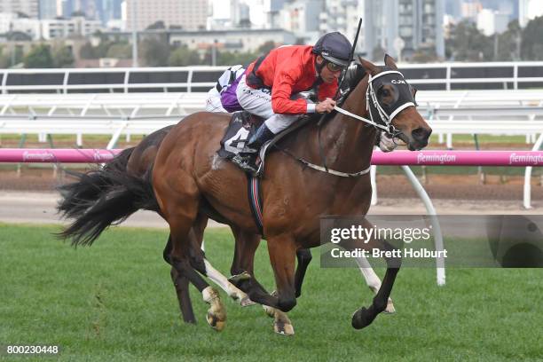 Encosta Line ridden by Damien Oliver wins the Grampians Region Handicap at Flemington Racecourse on June 24, 2017 in Flemington, Australia.