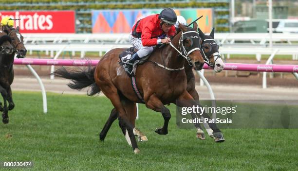 Encosta Line ridden by Damien Oliver wins the Grampians Region Handicap at Flemington Racecourse on June 24, 2017 in Flemington, Australia.