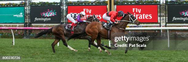 Encosta Line ridden by Damien Oliver wins the Grampians Region Handicap at Flemington Racecourse on June 24, 2017 in Flemington, Australia.