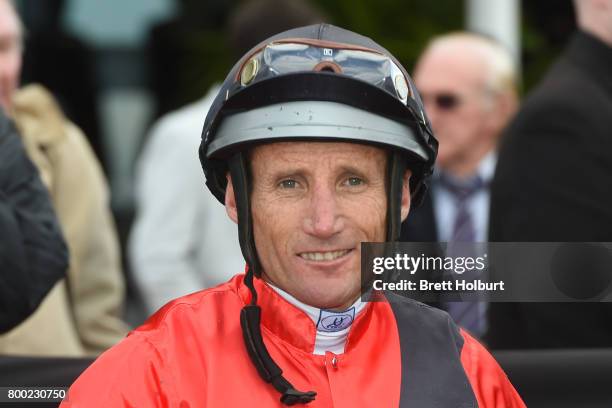 Damien Oliver returns to the mounting yard on Encosta Line after winning Grampians Region Handicap at Flemington Racecourse on June 24, 2017 in...