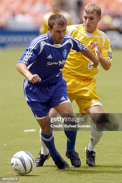 Dema Kovalenko and Ronnie O'Brien go after the ball at RFK Stadium on July 31, 2004. The Eastern Conference defeated the West 3-2.