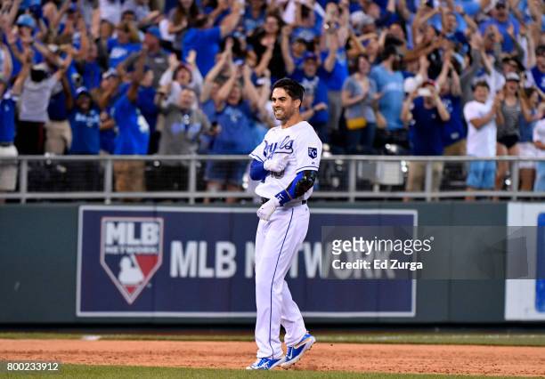 Whit Merrifield of the Kansas City Royals celebrates his game-winning two-run double in the ninth inning against the Toronto Blue Jays at Kauffman...