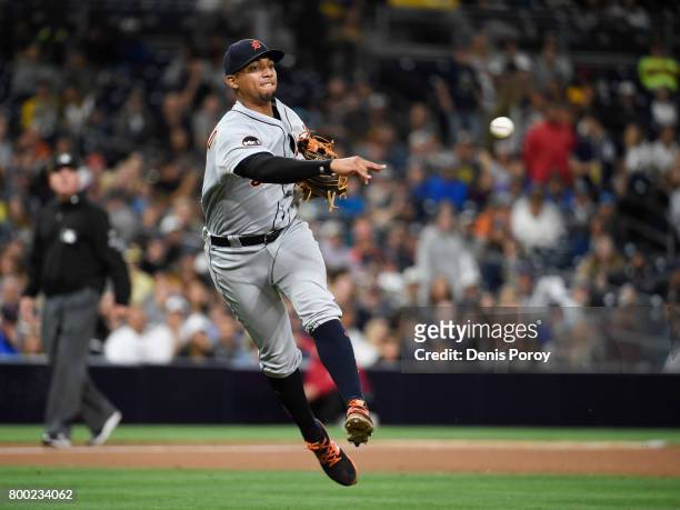 Dixon Machado of the Detroit Tigers throws out Franchy Cordero of the San Diego Padres during the seventh inning of a baseball game at PETCO Park on...