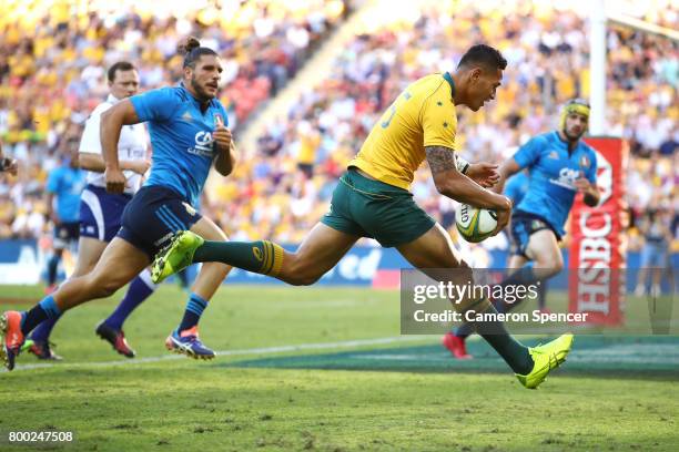 Israel Folau of the Wallabies scores a try during the International Test match between the Australian Wallabies and Italy at Suncorp Stadium on June...