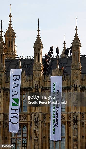 Protestors calling for a halt to the Heathrow airport expansion scale the roof of the Houses of Parliament on February 27, 2008 in London, England....