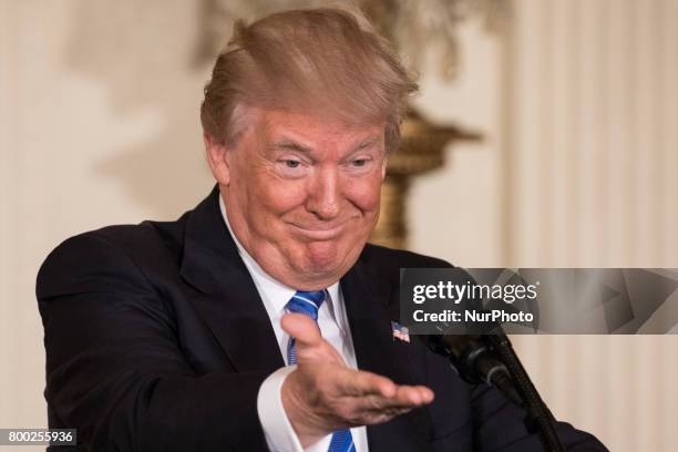 President Donald Trump speaks, before signing the Department of Veterans Affairs Accountability and Whistleblower Protection Act of 2017 in the East...