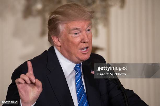 President Donald Trump speaks, before signing the Department of Veterans Affairs Accountability and Whistleblower Protection Act of 2017 in the East...