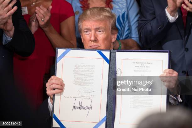 President Donald Trump signed the Department of Veterans Affairs Accountability and Whistleblower Protection Act of 2017 in the East Room of the...