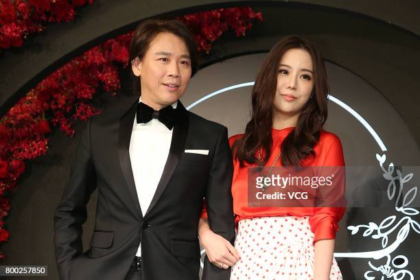 Actor David Tao and wife Penny Chiang arrive at the red carpet of the banquet held by Macau businessman Levo Chan and actress Ady An on June 23, 2017...