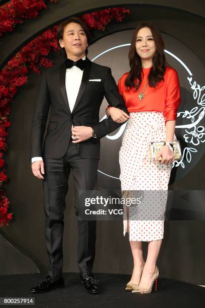 Actor David Tao and wife Penny Chiang arrive at the red carpet of the banquet held by Macau businessman Levo Chan and actress Ady An on June 23, 2017...
