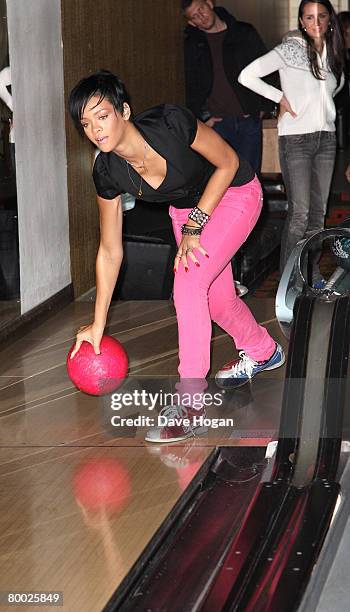 Rihanna plays a game of ten-pin bowling with friends ahead of her performance at the BRIT Awards at the Bloomsbury Lanes on February 19, 2008 in...