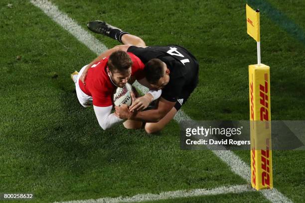 Elliot Daly of the Lions is tackled short of the tryline by Israel Dagg of the All Blacks during the first test match between the New Zealand All...