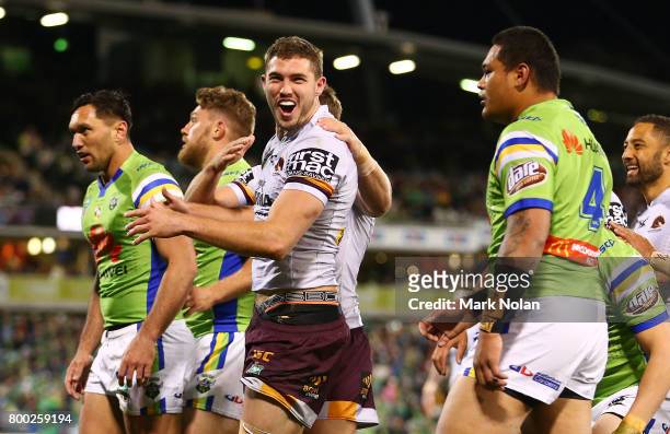 Corey Oates of the Broncos celebrates scoring a try during the round 16 NRL match between the Canberra Raiders and the Brisbane Broncos at GIO...