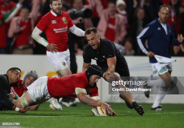 Sean O'Brien of the Lions dives over to score his team's first try during the first test match between the New Zealand All Blacks and the British &...