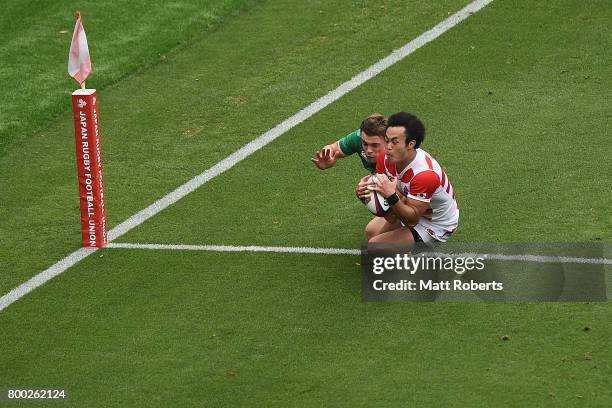 Kenki Fukuoka of Japan competes for the ball against Garry Ringrose of Ireland during the international rugby friendly match between Japan and...