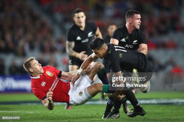 Liam Williams of the Lions is tackled by Rieko Ioane of the All Blacks during the first test match between the New Zealand All Blacks and the British...