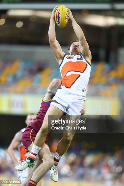 Toby Greene of the Giants takes a mark during the round 14 AFL match between the Brisbane Lions and the Greater Western Sydney Giants at The Gabba on...