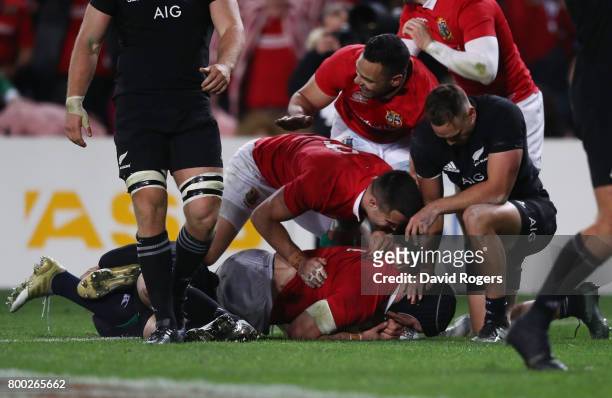 Sean O'Brien of the Lions is congratulated by teammates after scoring his team's first try during the first test match between the New Zealand All...