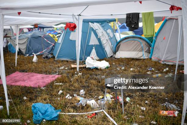 Abandoned tens stand in rain and mud at the camp site of the Hurricane Festival 2017 after a night full of heavy rain and winds on June 24, 2017 in...