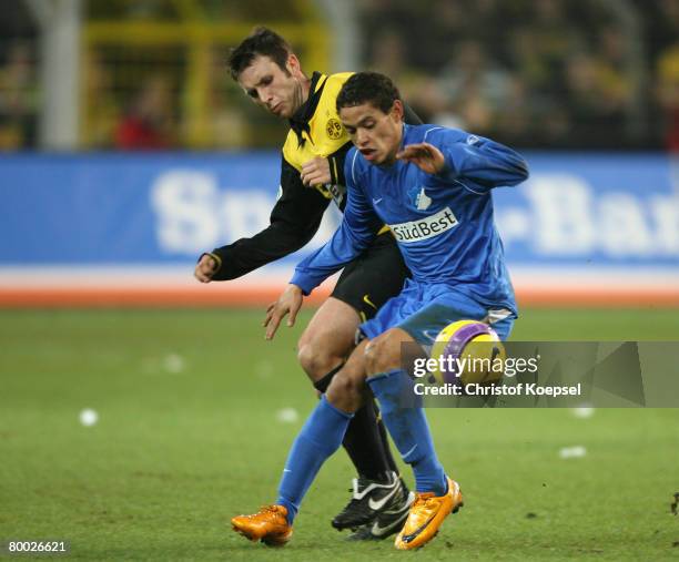 Marc-Andre Kruska of Dortmund tackles Eduardo of Hoffenheim during the DFB Cup Quarter-Final match between Borussia Dortmund and 1899 Hoffenheim at...