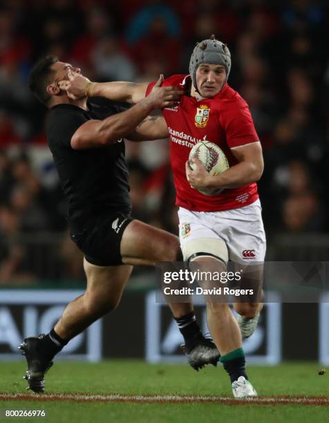 Jonathan Davies of the Lions hands off Anton Lienert-Brown of the All Blacks during the first test match between the New Zealand All Blacks and the...