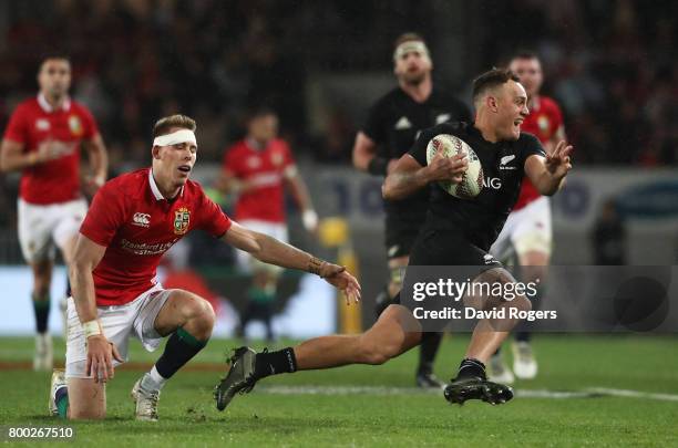 Israel Dagg of the All Blacks evades Liam Williams of the Lions during the first test match between the New Zealand All Blacks and the British &...