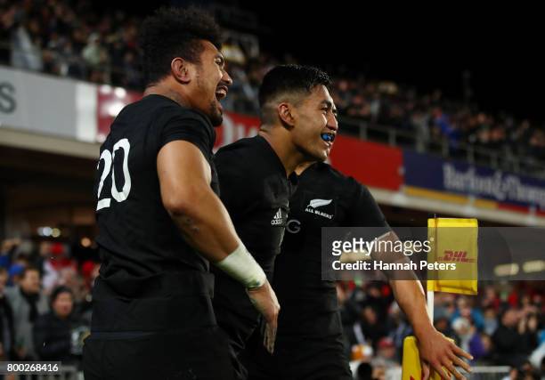 Rieko Ioane of the All Blacks is congratulated by teammates after scoring his team's second try during the first test match between the New Zealand...