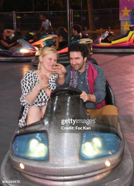 Anna Sherbinina and her compnion attend La Fete des Tuileries on June 23, 2017 in Paris, France.