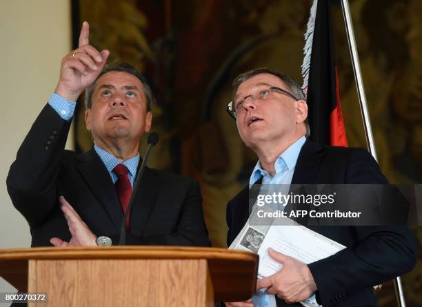 Czech Foreign Lubomir Zaoralek talks with his German counterpart Sigmar Gabriel after their press conference on June 24, 2017 in Prague. / AFP PHOTO...