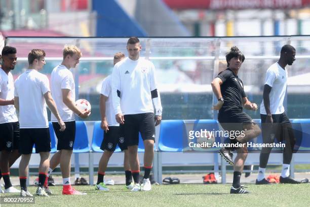 Jochim Loew, head coach of team Germany plays with the ball during a Germany training session ahead of their FIFA Confederations Cup Russia 2017...