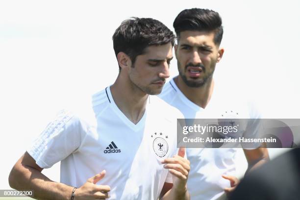 Lars Stindl of Germany runs with his team mate Emre Can during a Germany training session ahead of their FIFA Confederations Cup Russia 2017 Group B...