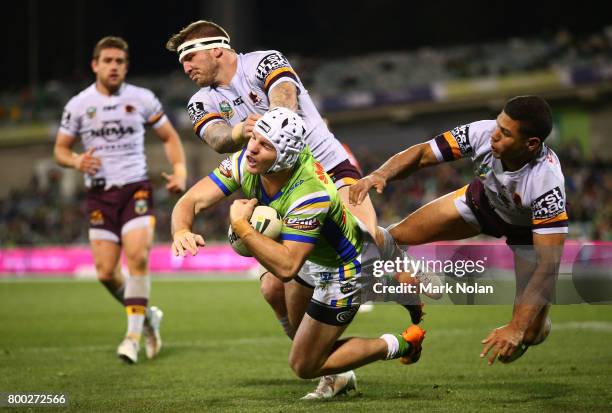 Josh McGuire of the Broncos tackles Jarrod Croker of the Raiders during the round 16 NRL match between the Canberra Raiders and the Brisbane Broncos...