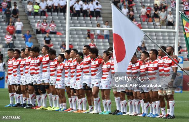 Players of Japan's rugby national team sing the national anthem prior to their rugby union Test match against Ireland in Tokyo on June 24, 2017. /...