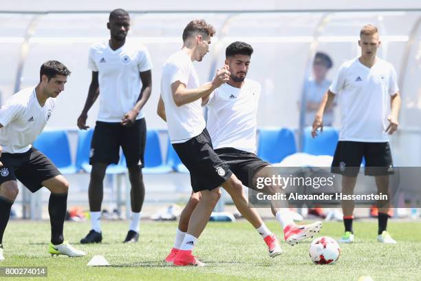 Leon Goretzka of Germany plays the ball with Emre Can of during a Germany training session ahead of their FIFA Confederations Cup Russia 2017 Group B...