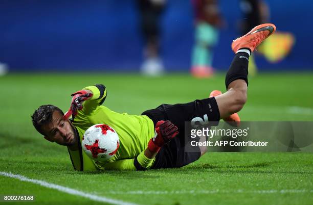 Macedonia's goalkeeper Damjan Siskovski saves a ball during the UEFA U-21 European Championship Group B football match FYR Macedonia vs Portugal in...