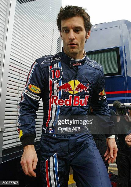 Red Bull's Australian Formula 1 driver Mark Webber walks in the pits during a test session at the Catalonia racetrack in Montmelo near Barcelona on...