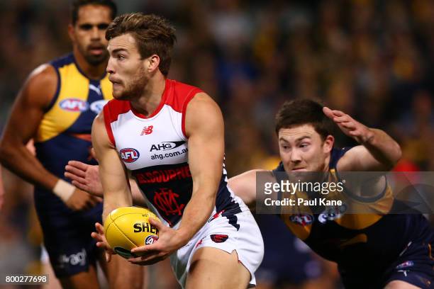 Jack Viney of the Demons looks to handball during the round 14 AFL match between the West Coast Eagles and the Melbourne Demons at Domain Stadium on...