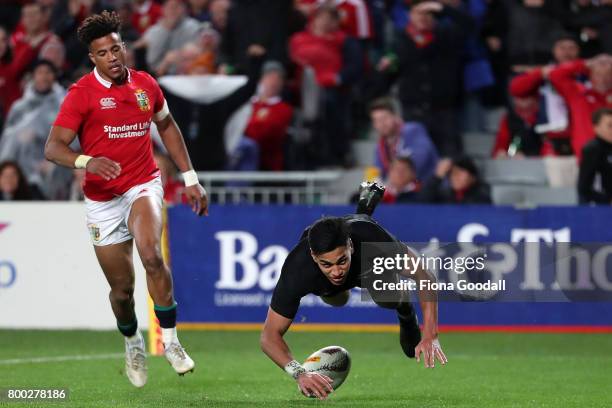 Rieko Ioane of the All Blacks scores a try with Anthony Watson of the Lions chasing during the Test match between the New Zealand All Blacks and the...